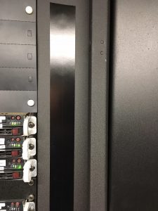 Black mag seal strip on data center server rack.
