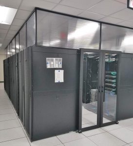 Data Center with double sliding doors, servers, raised floor and sub containment panels.