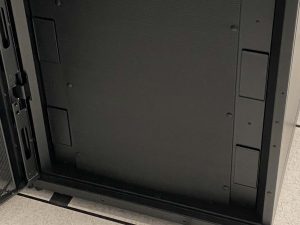Black blanking panel with black clips on server rack