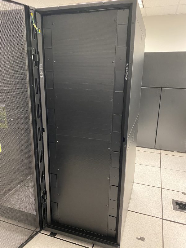 Black server with open door in a data center